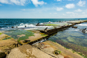 View of abandoned sea resort concrete buildings and structures in ruins near St. Constantine and Helena, city of Varna, Bulgaria, the shores of Black Sea, EU