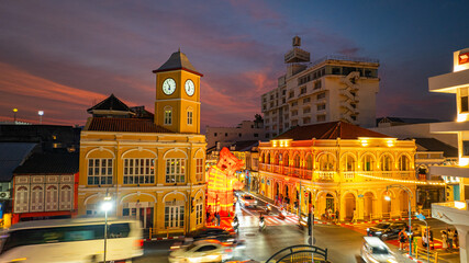 Naklejka premium Phuket,Thailand-February 10,2025: Valuable Sino-Portuguese style architecture in the heart of Phuket city at night..beautiful sky in twilight. popular landmark in Phuket.