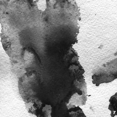 A watercolor background with black splashes