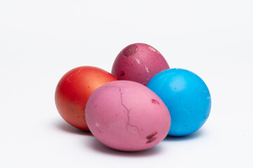 Four colored Easter eggs  on the white background  ready to be split to  friends and family for Easter