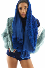 Chic young woman showcases trendy attire style with stylish layers and bold accessories