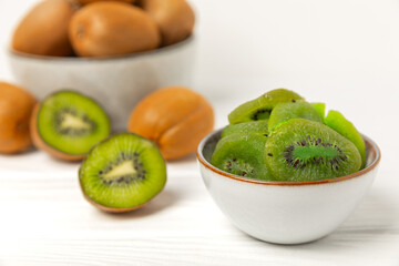 Kiwi dried fruit on wooden background. kiwi candied fruit. Healthy food. Ingredient for baking cupcakes. Healthy snack, vegetarian sweets. Space for text. Copy space