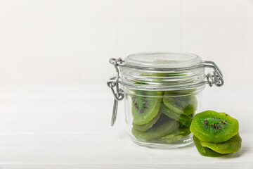 Kiwi dried fruit on wooden background. kiwi candied fruit. Healthy food. Ingredient for baking cupcakes. Healthy snack, vegetarian sweets. Space for text. Copy space