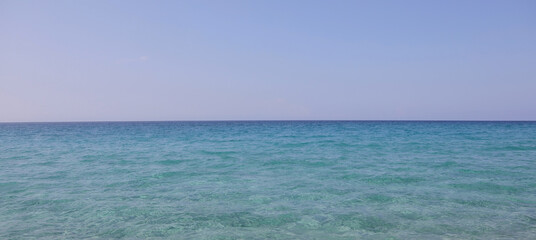 marine environment background the blue sky above and with the blue ocean below without boats