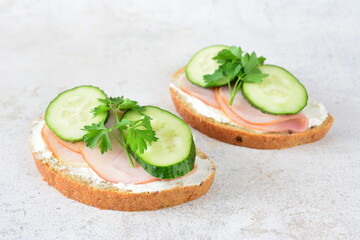 Ham and Cucumber Sandwiches on the gray background