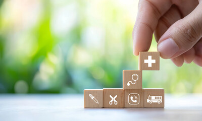 Building health insurance concept with wooden blocks, showcasing medical symbols and tools. This represents importance of health coverage and services