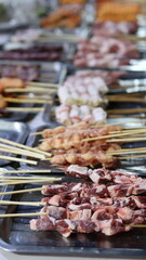 Delicious Street Food Skewers at a  Chinese Night Market Grill