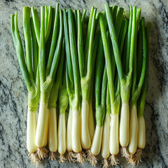 Obraz premium Fresh green onions on marble kitchen counter, ready for cooking