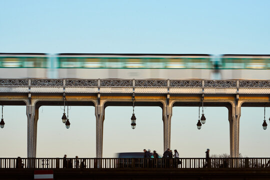 Where history meets the city's rhythm: the Bir-Hakeim Bridge and the Paris metro create an iconic image, capturing the vibrant essence of the French capital.