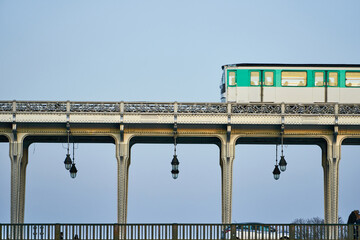 Classic Parisian metro running over the Bir-Hakeim bridge sequence 