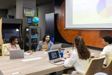 Modern office meeting with diverse team collaboration