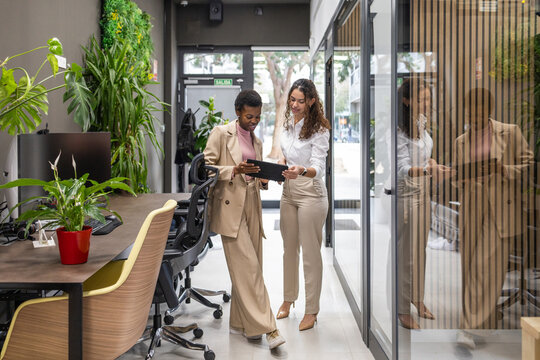 Collaborative team discussion in a modern open-plan office setting