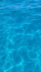 Blue sea water photo background texture with ripple, close-up. with white shades