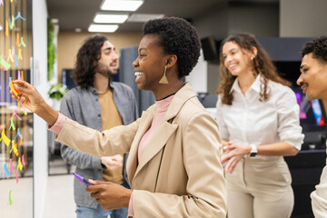 Collaborative office team brainstorming with sticky notes