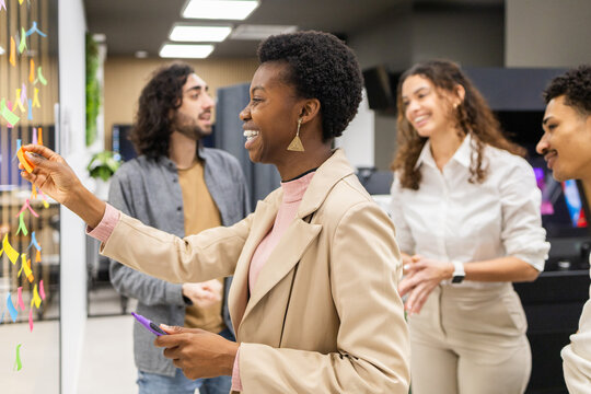 Collaborative office team brainstorming with sticky notes