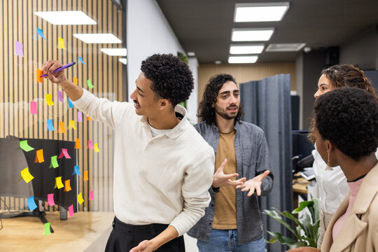 Office team brainstorming with colorful sticky notes