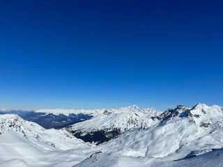 snow covered mountains in winter val thorens french alps