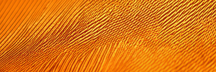 Fototapeta premium Bright amber cotton fabric with diagonal twill weave pattern for creative design projects