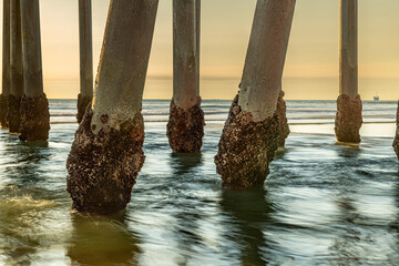 Pier pilings with water flow