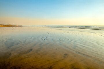 Low tide at beach provides an expansive landscape for placement of copy.