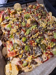Name of this dish is Mexican Street Corn Nachos home made in owen