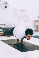 Fototapeta premium Focused man in Lotus position supported by hands near woman