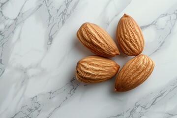Three almonds are arranged in a triangle on a white marble countertop, highlighting their natural beauty