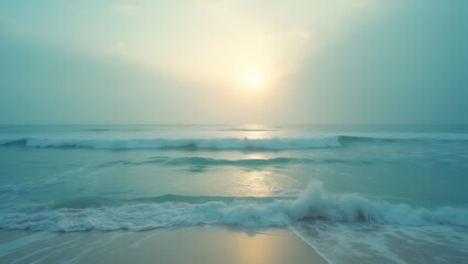 Fototapeta premium A serene, tranquil seascape features soft waves meeting the sandy shore under a hazy, sunlit sky. 