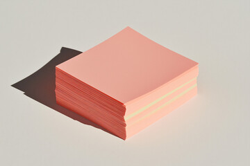 Stack of Pink Sticky Notes: A simple yet visually appealing photograph of a stack of pink sticky notes, perfectly aligned against a light background. The image evokes feelings of organization.