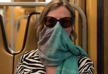 Uccle, Brussels Capital Region  Belgium - 05 17 2020 Attractive 30 yo woman covering her nose and...