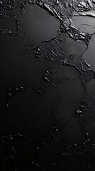 Abstract black textured surface with intricate patterns showcasing depth and contrast.