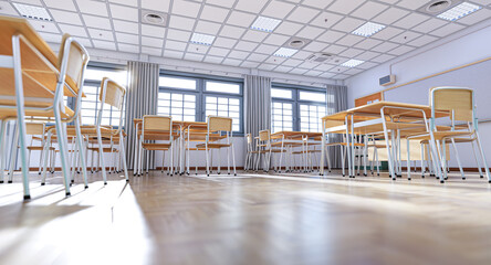 Sunlight illuminating empty classroom with wooden desks and chairs