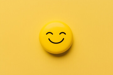 Fototapeta premium Smiling Yellow Emoji: A cheerful yellow emoticon with a simple, joyful smile, set against a vibrant yellow background. The image evokes feelings of happiness, positivity, and good vibes.