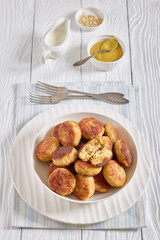 Northern Pike fish cakes in a white bowl