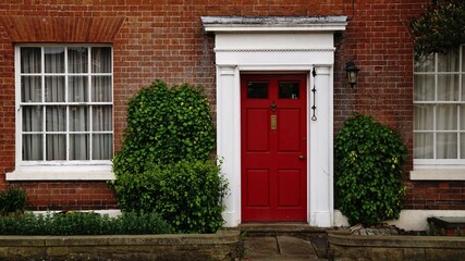 British house facade with door and window, as background