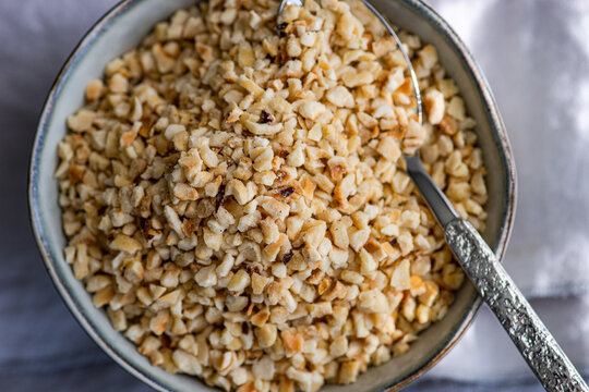 Chopped hazelnuts in a bowl photographed from above