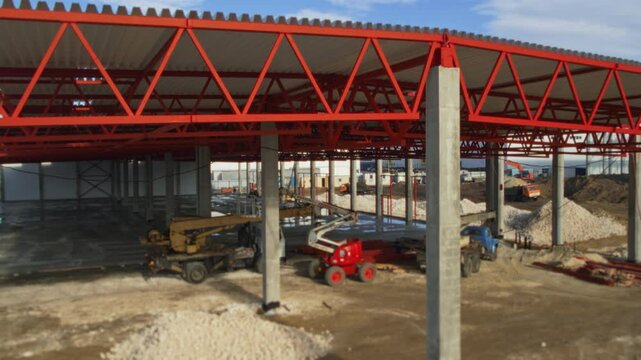 A Construction Site Featuring Large Piles of Gravel Alongside Various Types of Equipment