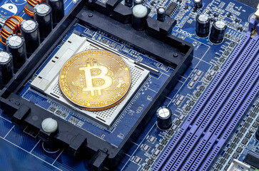 Golden bitcoin on background of computer parts. Concept of digital cryptocurrency bitcoin. Latest technologies.