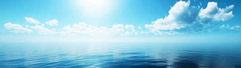 Fototapeta premium Calm ocean horizon under bright blue sky with fluffy clouds and serene water