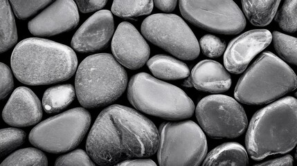 Fototapeta premium Close-up view of dark black gravel rocks showcasing sharp textures and unique contrast ideal for minimalist garden designs