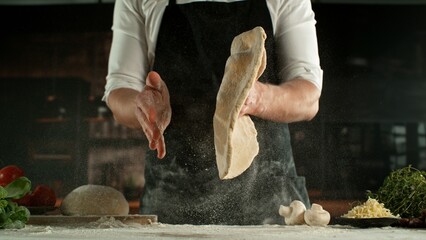Freeze Motion of Chef Making Yeast Dough . Closeup of Bread or Pizza Dough Preparation