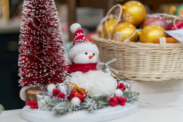 Colorful holiday display with snowman and festive decorations on street