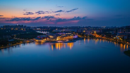 Fototapeta premium Aerial View of City Skyline Under Colorful Twilight at Night