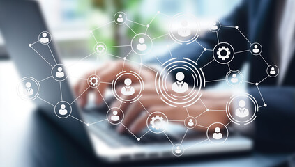 A modern workspace integrates digital tools and human elements, fostering collaboration among remote teams. The environment highlights flexibility, AI resources, and a focus on productivity