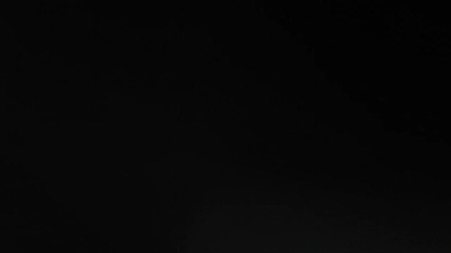 Fast-motion flash noise transition with energetic noise texture and explosive light bursts for video production