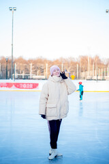 Winter fun, sports and vacation activities. Kids skating at the rink. Moscow Botanical Garden