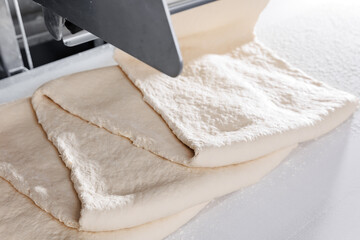 Automated puff pastry dough formation in confectionery production line