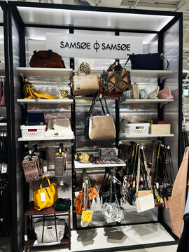 Kyiv, Ukraine - February 09, 2025: Modern retail Samsoe display showcasing designer handbags and fashionable accessories in-store