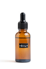 Dropper bottle is made amber glass with inscription oil with black lid on white background.