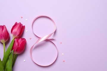 8 March, International Women's Day. Figure eight made of pink ribbon with beautiful tulips on a color background. Space for text